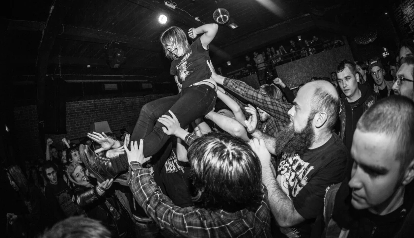 a crowd is shown as someone jumped into the air on top of a person