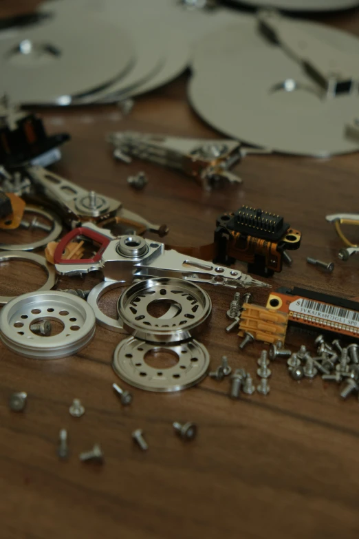 a table with metal parts and a wooden floor