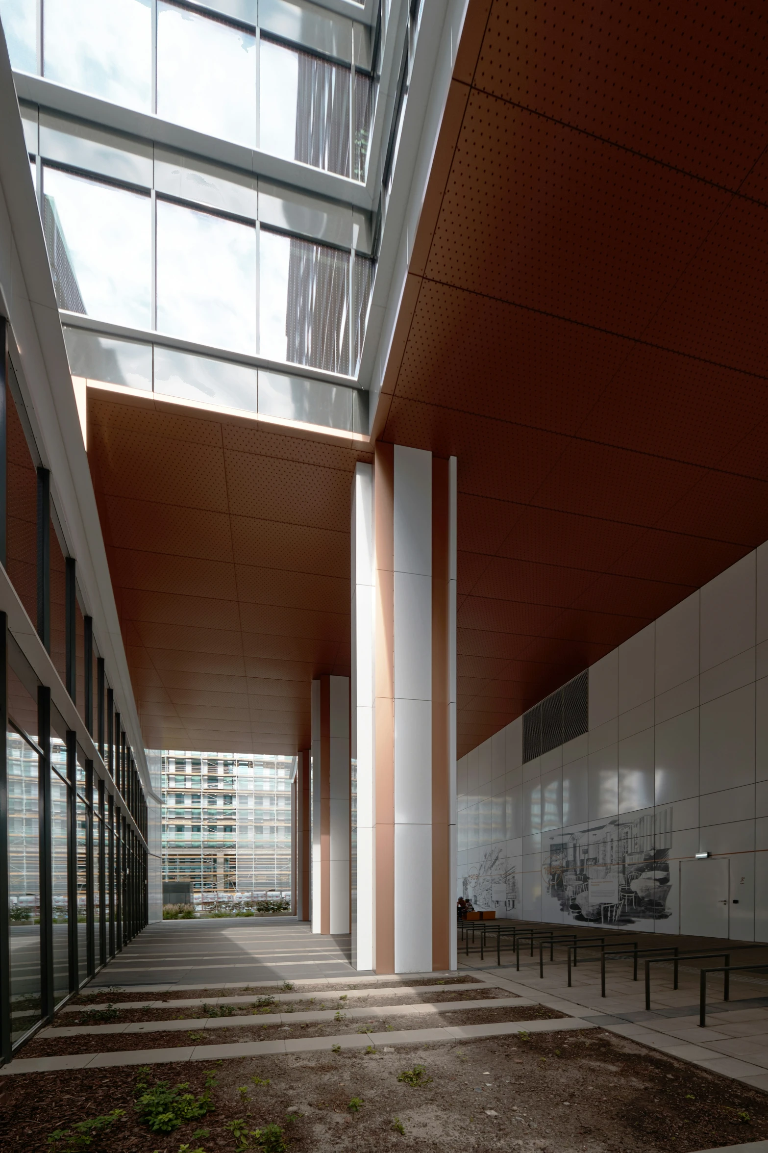 a building with a very long ceiling and glass doors