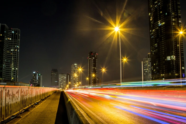 a street at night time with car lights blurry