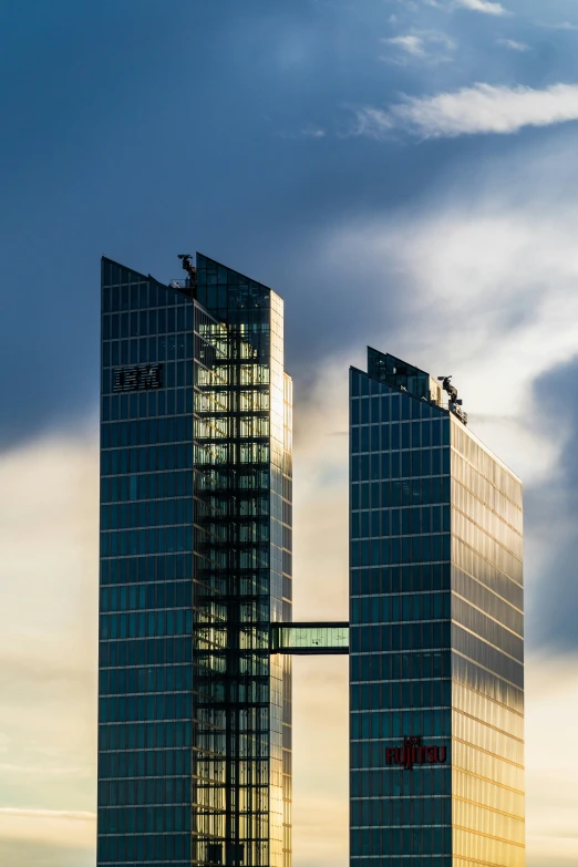 two tall buildings sitting on the side of a city street