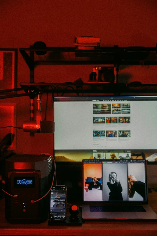 a laptop and monitor sitting on a desk