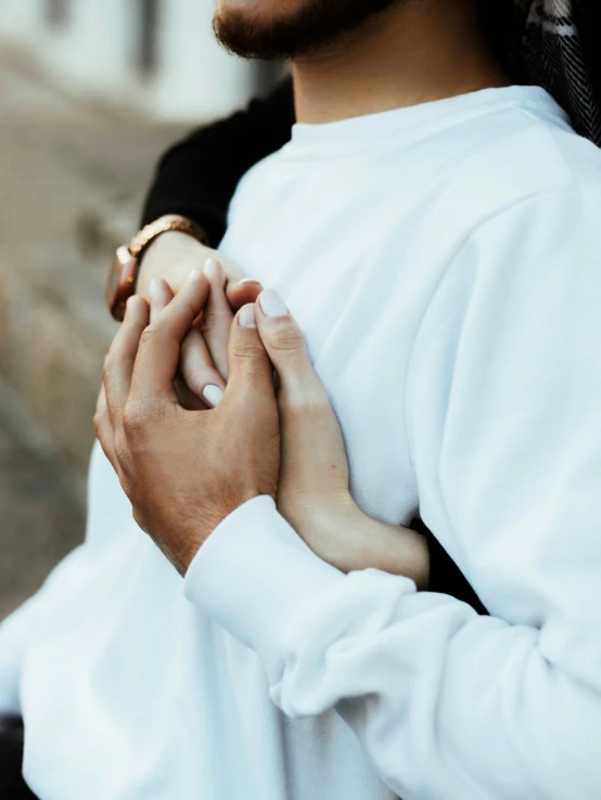 a close up of the hand of someone holding the other hand