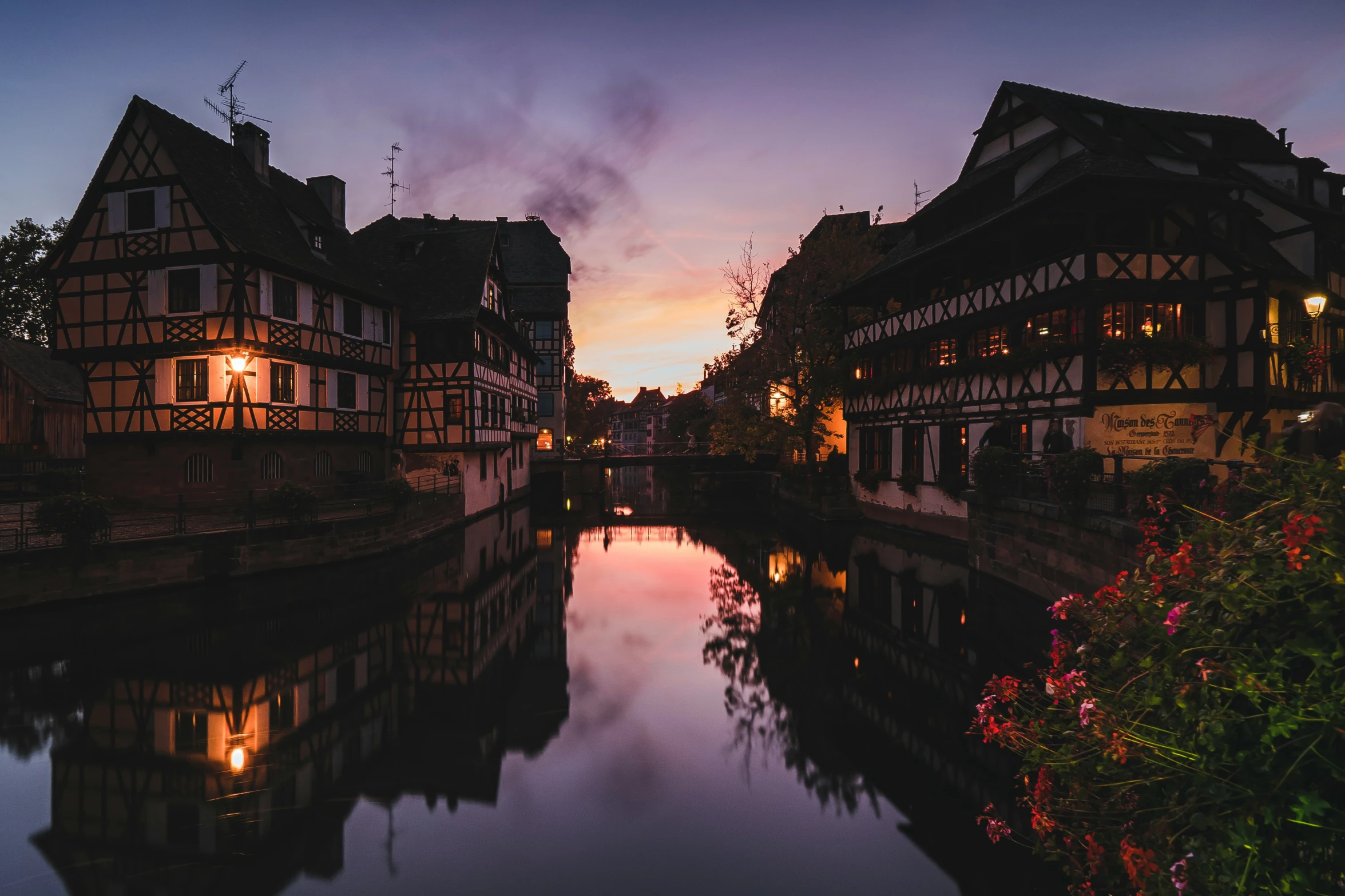 the canal of a city street at dusk