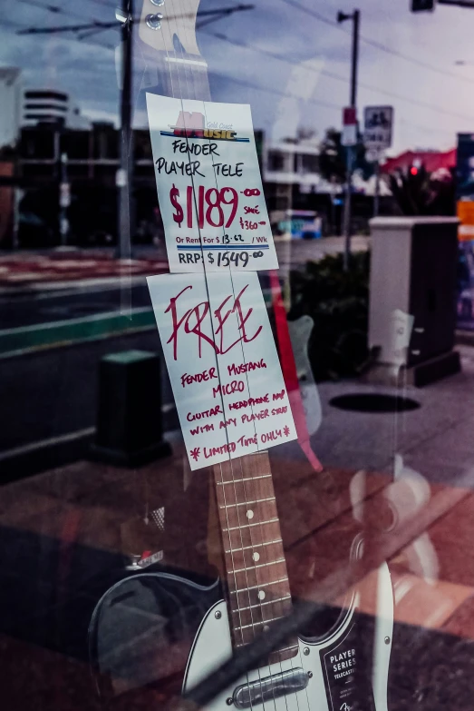 the guitar was placed next to the window