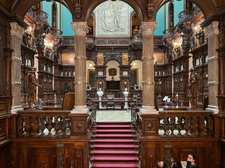 an ornately decorated liry with pink stairs