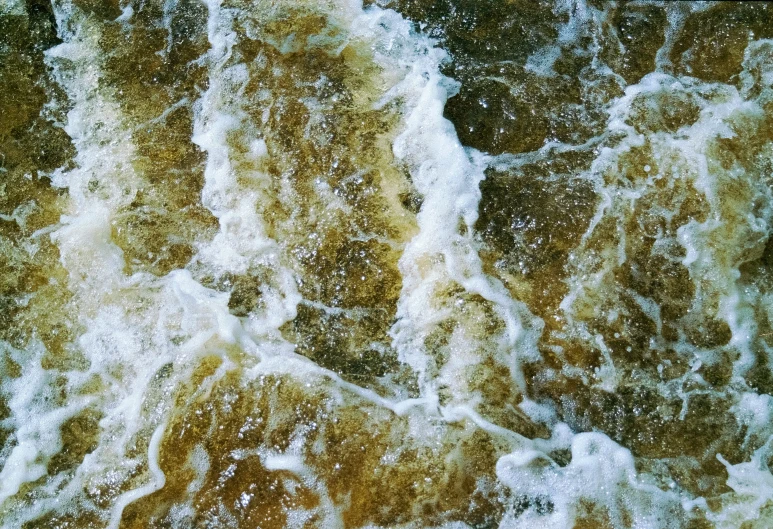 waves breaking up on top of the rocks