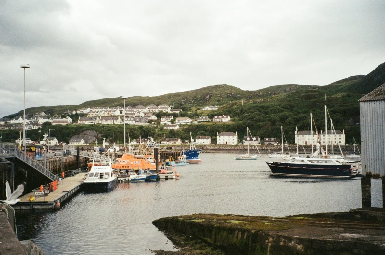 several boats sitting at a dock in the water