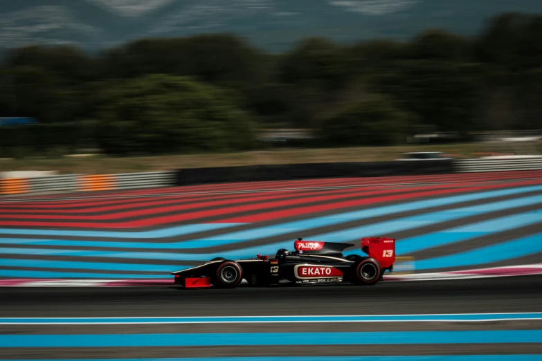 the car drives along the track during the day