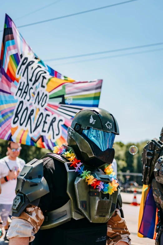 a man wearing a helmet and holding a sign