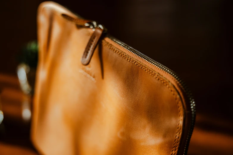 this is an orange handbag next to another bag