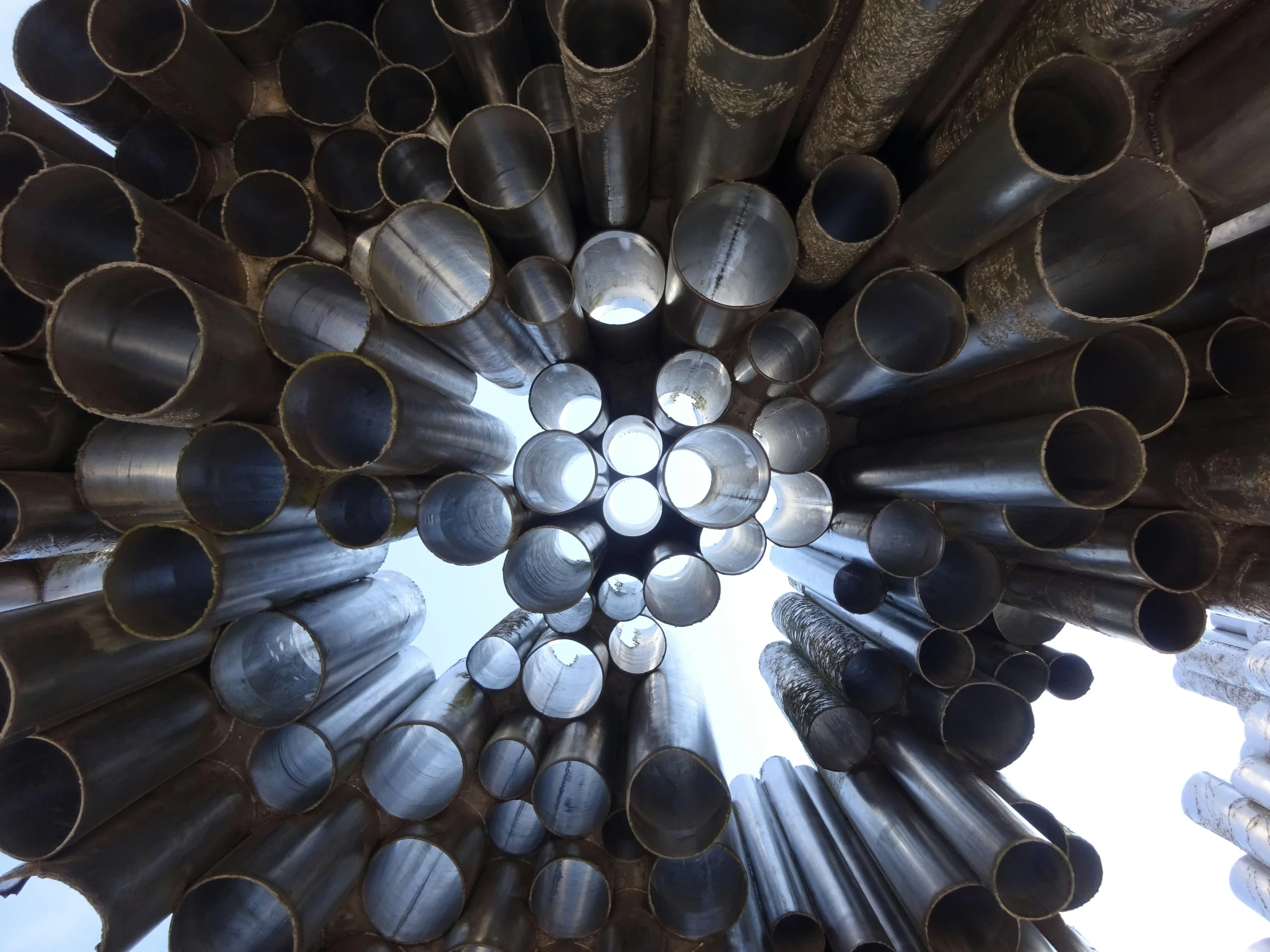 the underside of a large pile of pipe sizes