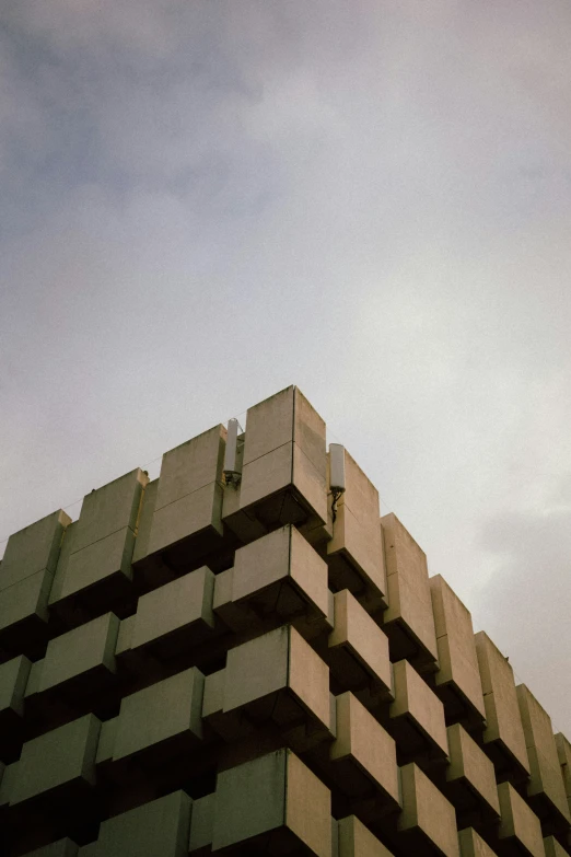 a tall building with a large amount of boxes in the background