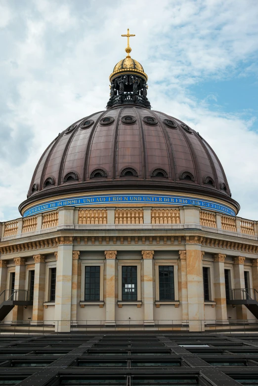 the dome on top of a building with steps in front