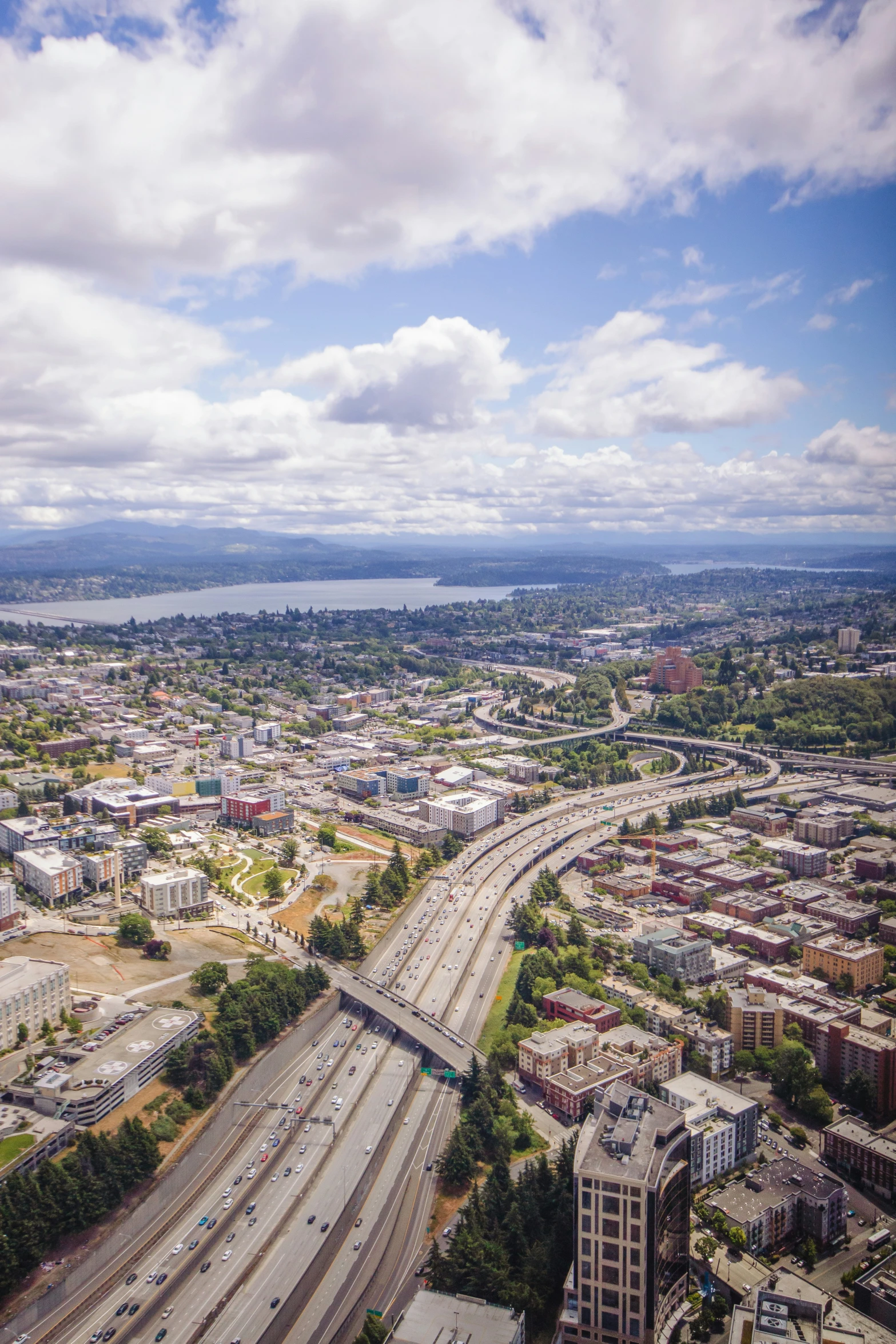 a large city skyline with an abundance of freeway traffic