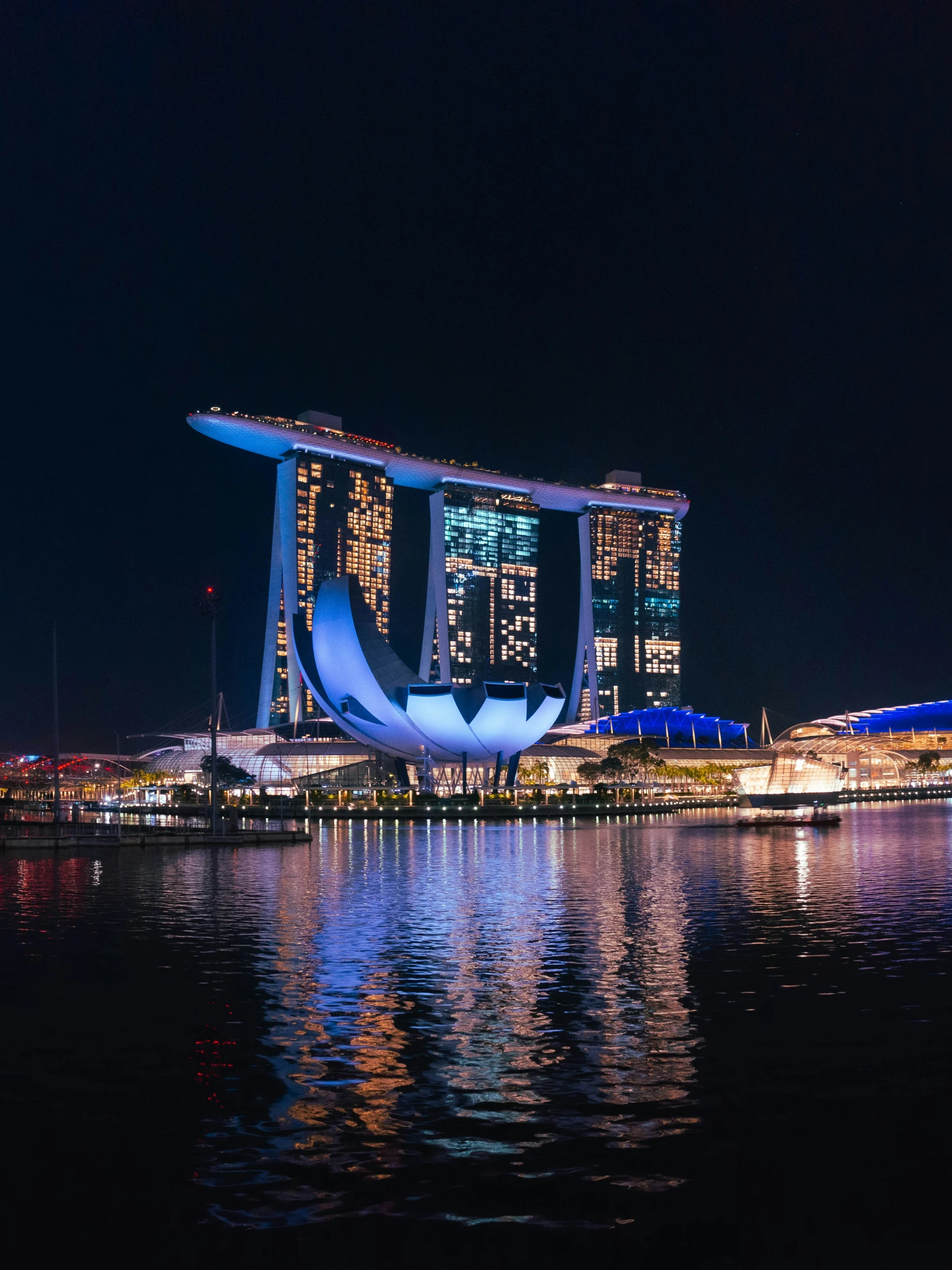 some tall buildings in a body of water