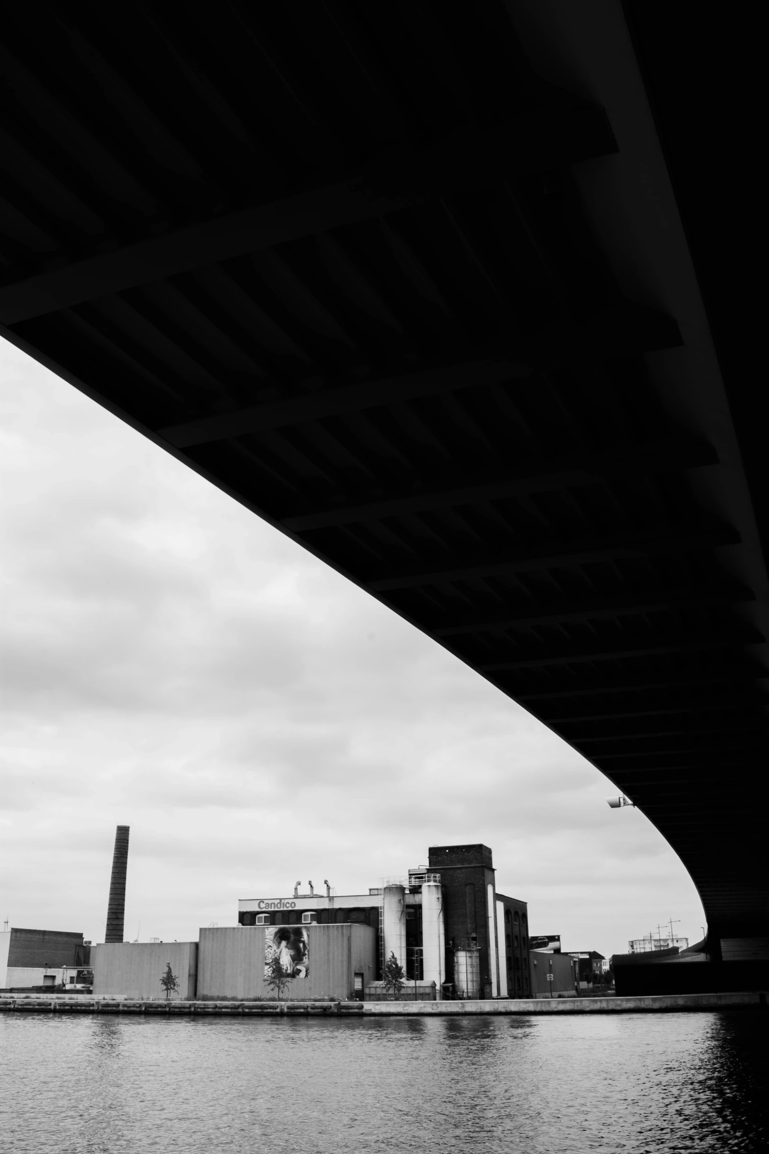 a large bridge has a huge body of water under it