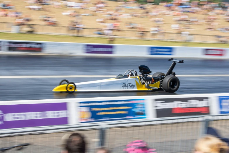 a man that is standing on a race track