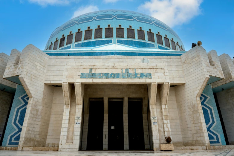 large building with a very decorative blue roof