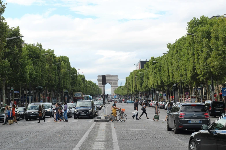 people walking, riding bikes, and playing in the street