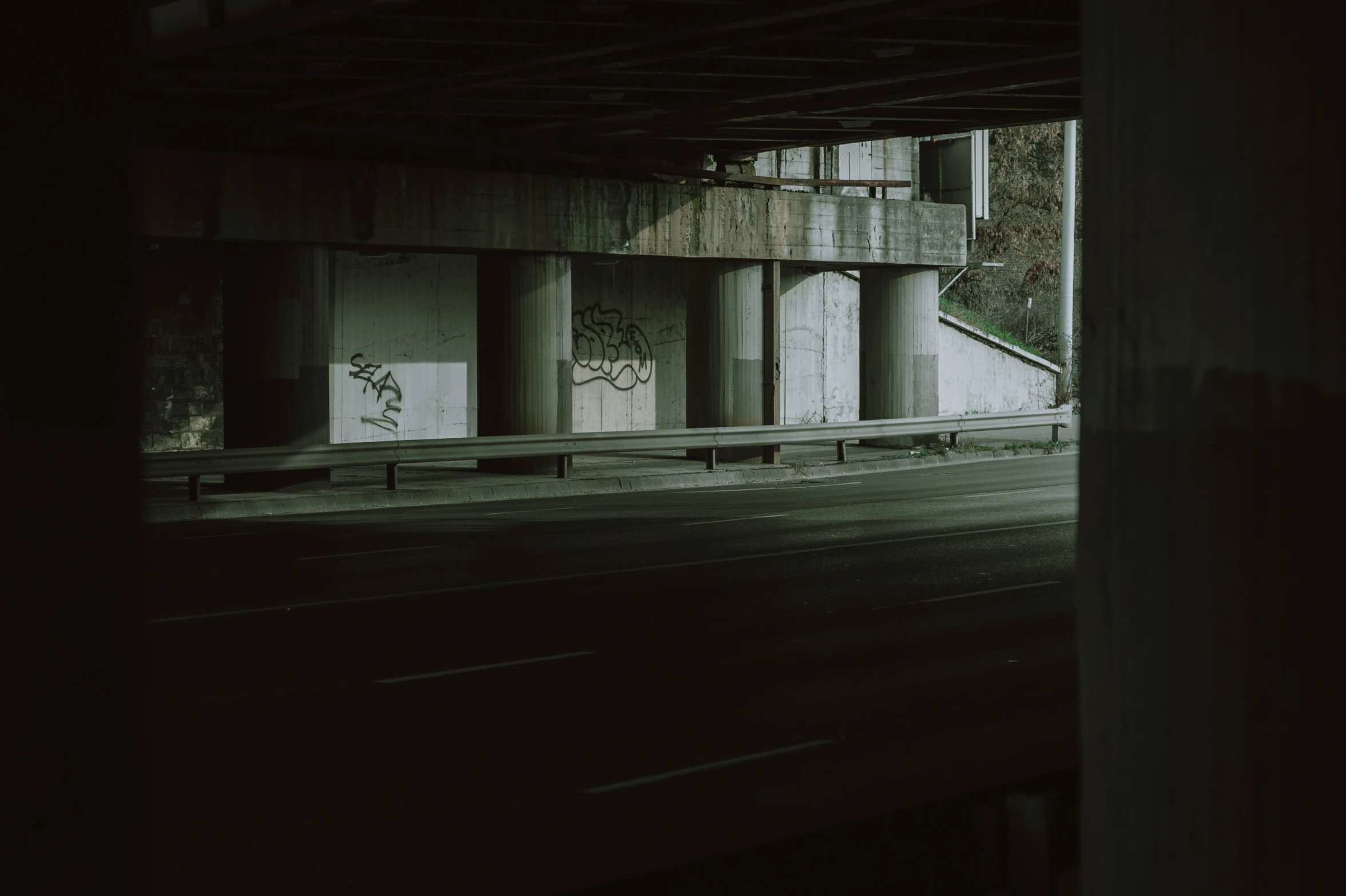 a empty parking garage with graffiti painted on it