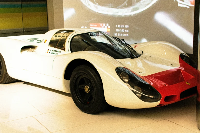 this classic race car sits on display in the museum