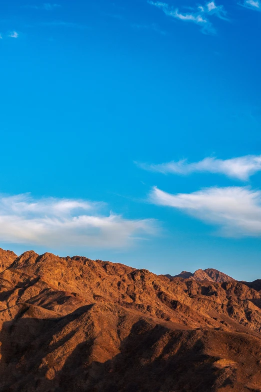 a big sky with some mountains in the background