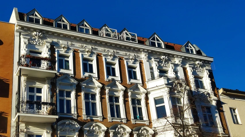 a tall building with windows on a sunny day