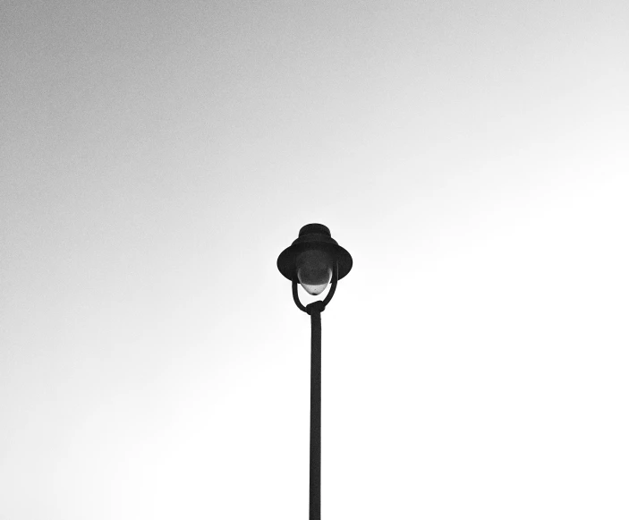 a lamp post with a clock sitting on top