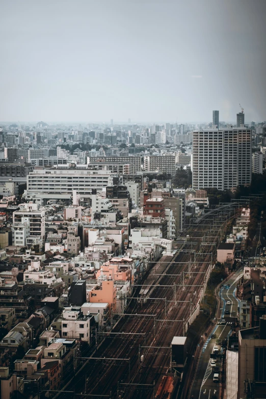 a city view with an overcast sky and skyscrs in the background