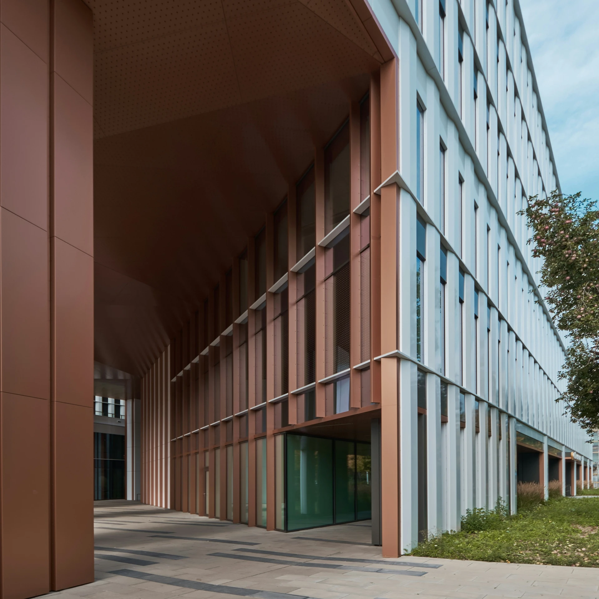 the entrance to a large building with a red and blue color scheme