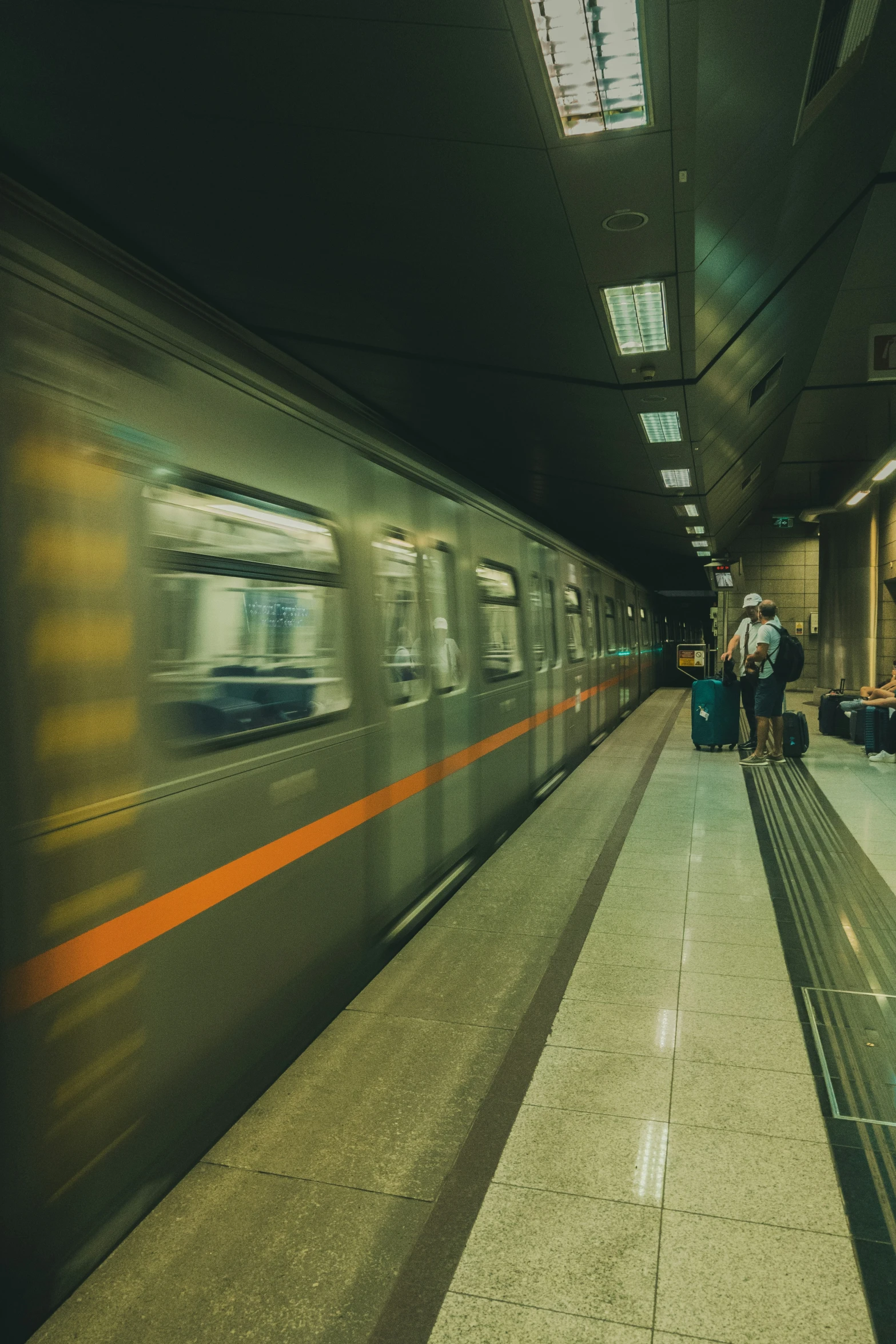 people waiting for the train in a subway station