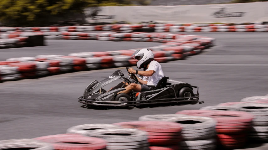 two s on race cars racing around on ramps