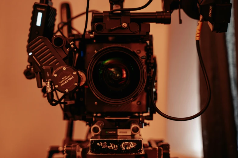 a camera attached to a tripod on a stand