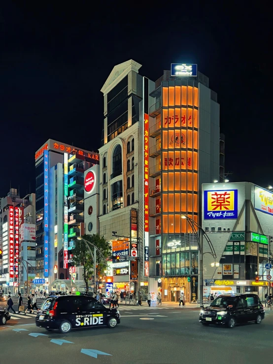 an asian city street scene at night with neon signs