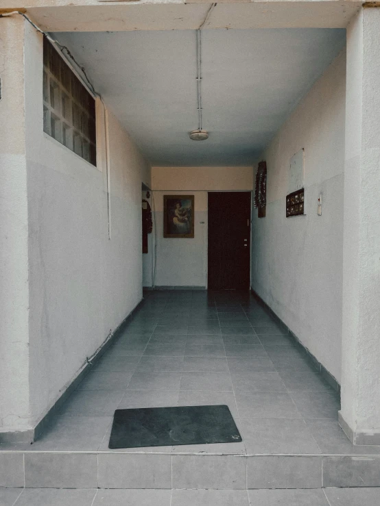 a room with white walls and an entrance leading into it