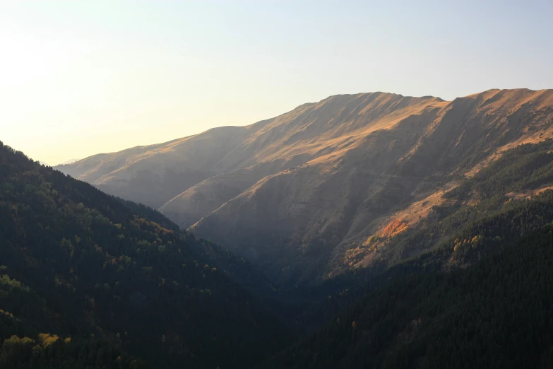 view from the top of a steep mountain at sunset