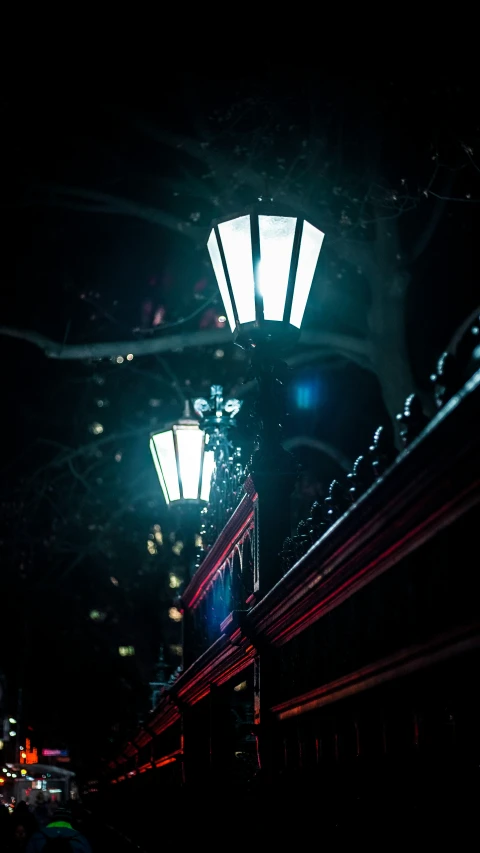 a street scene with a dark background and some lights