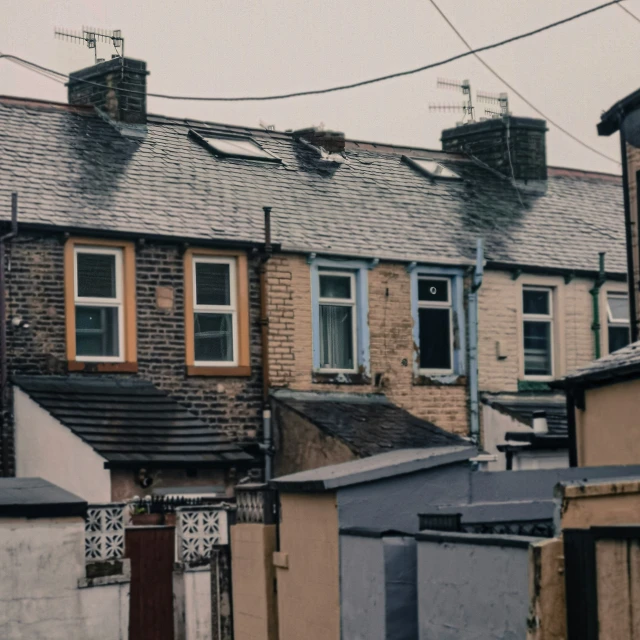 houses in an old neighborhood are lined with fences