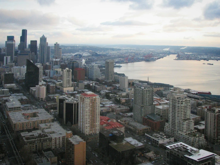 view of city from a tall building near a harbor