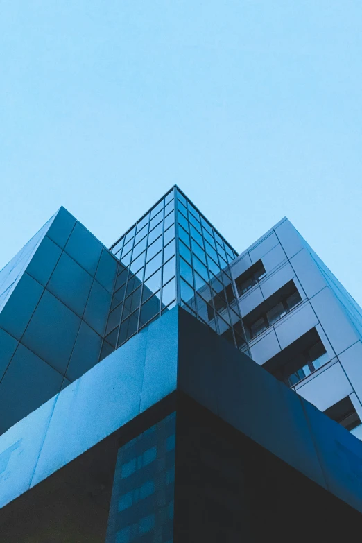 an office building with many windows in front of it