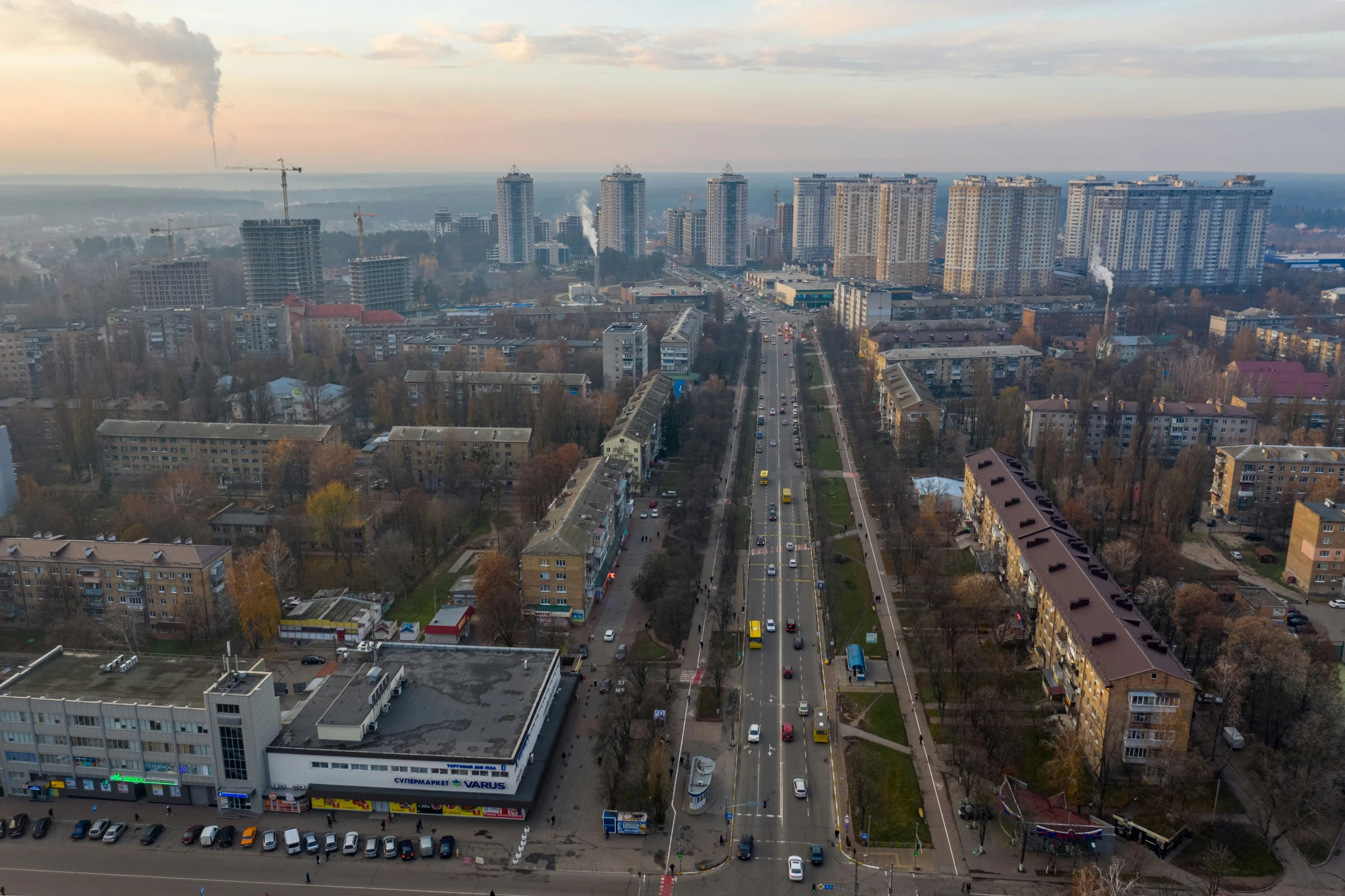 an aerial view of a city with large buildings