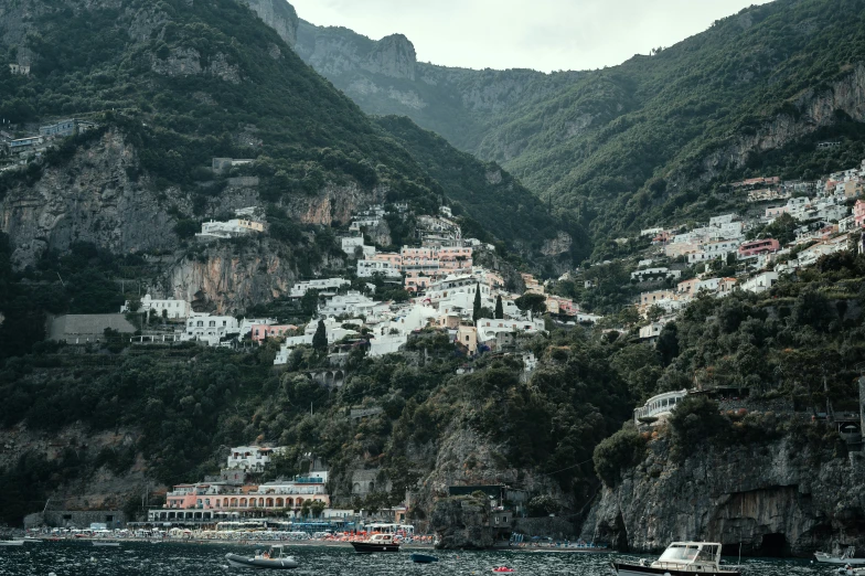 boats in the water near the mountains