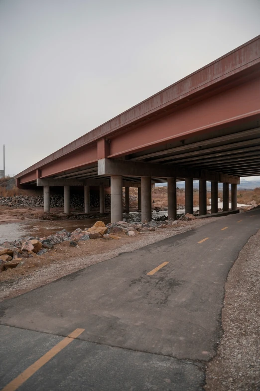 an overhead highway bridge with road going under it