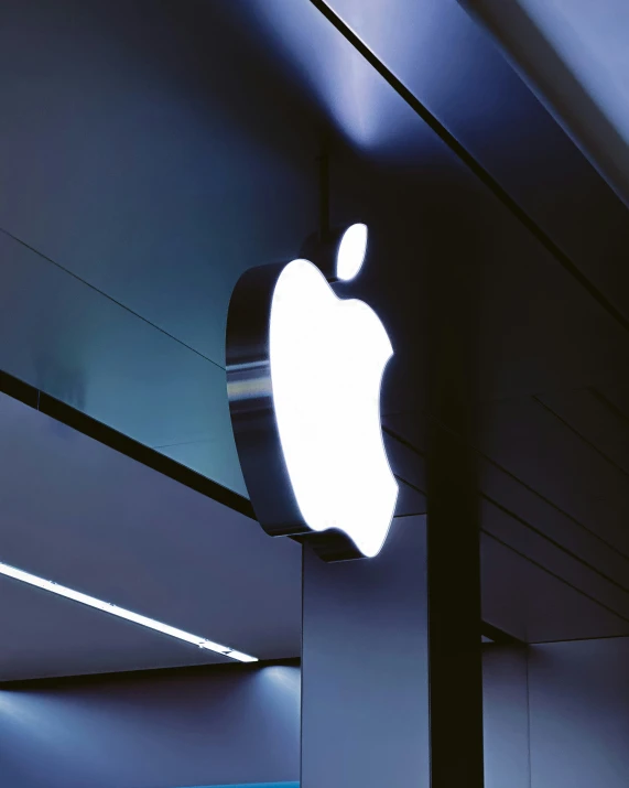 an apple logo above the front of the store