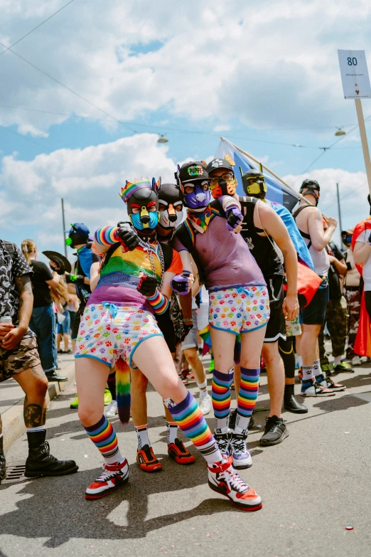 some women dressed in colorful clothing and boots on roller skates