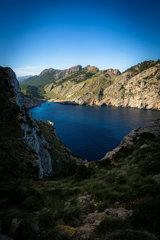 there is a large body of water near the mountains