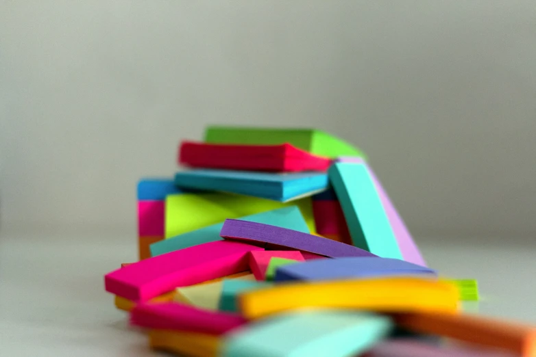 several different colored blocks laid together on a table