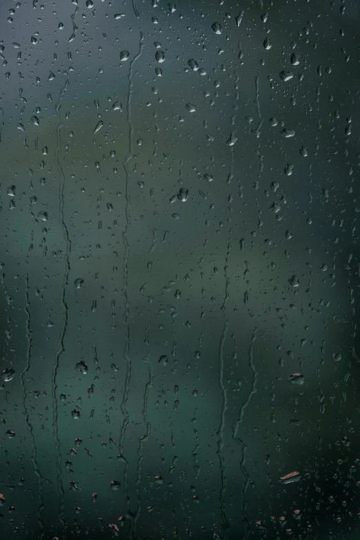 drops of rain on the window in an otherwise cloudy day