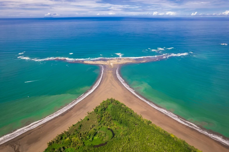 a stretch of land is between the ocean and the beach